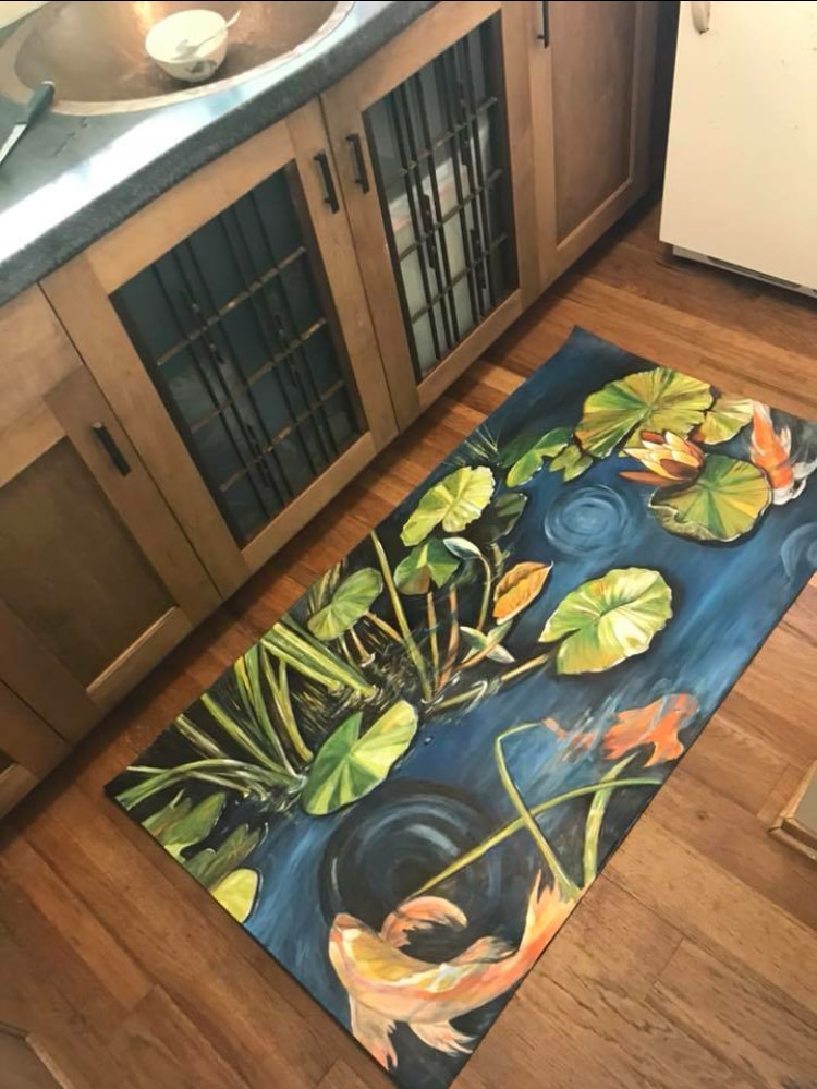 Deborah Thompson custom painted a koi and lily pad design on a kitchen floor mat. 