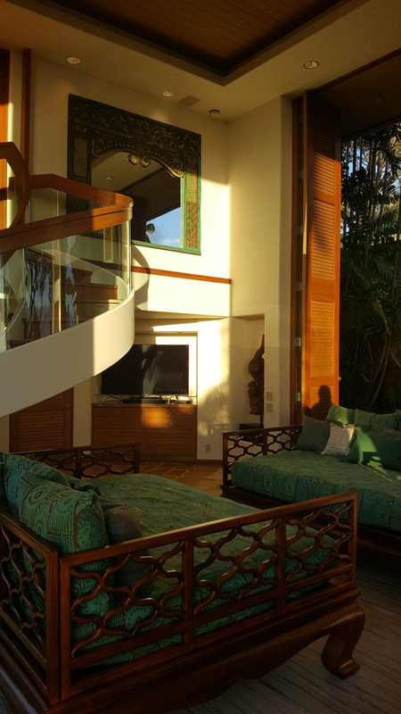 Thompson Art Studios used paint and plaster to enhance the walls of an outside inside style room at Mauna Kea Fairways. 