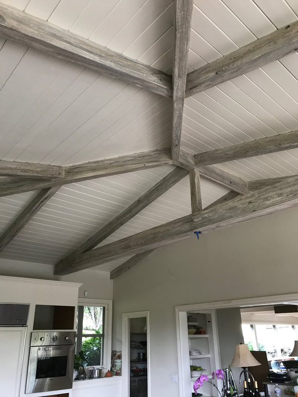 Thompson Art Studios specializes in fake wood grain like the silvery finish on these ceiling beams.