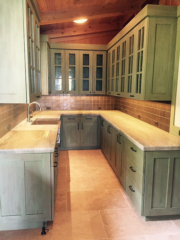 Kitchen cabinets painted a distressed crackle finish by Thompson Art Studios.